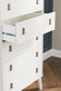 Aprilyn Queen Panel Headboard with Dresser, Chest and 2 Nightstands